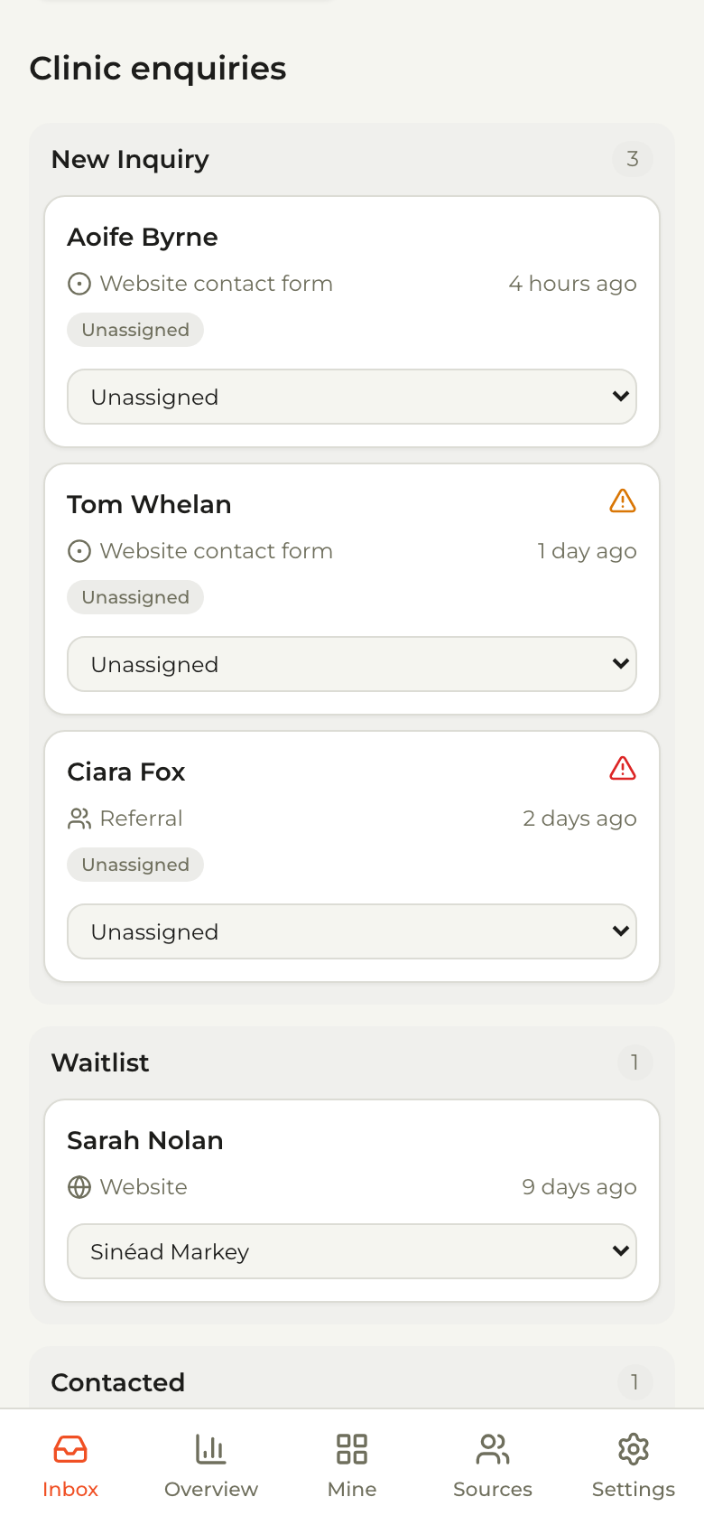 The clinic inbox on a phone, with enquiry cards stacked by stage and an assignee on each